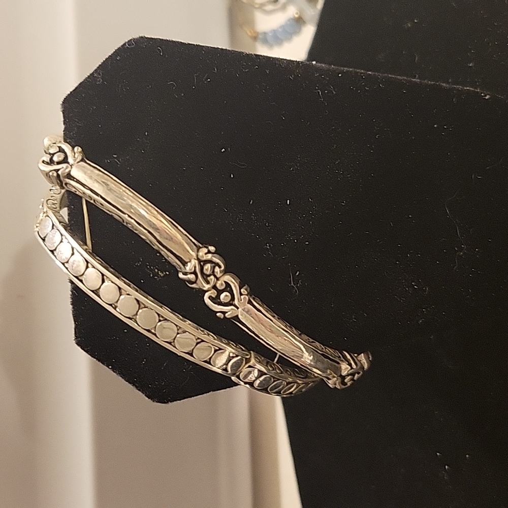 Set of 2 Silvertone Stretch Bracelets with geart and circle detail - 7.5 in